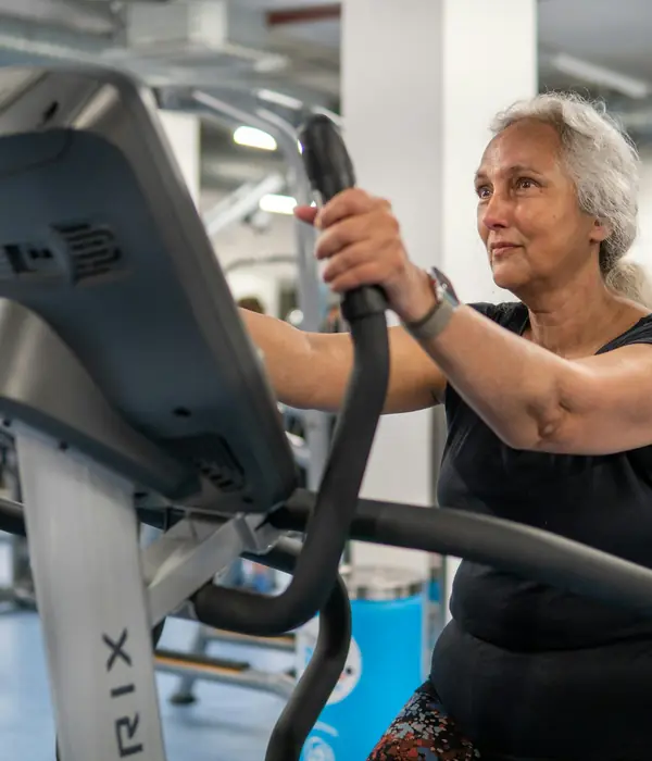 PLACEHOLDER stock photo of an older adult exercising in a gym; not a Fifty+ Fitness client